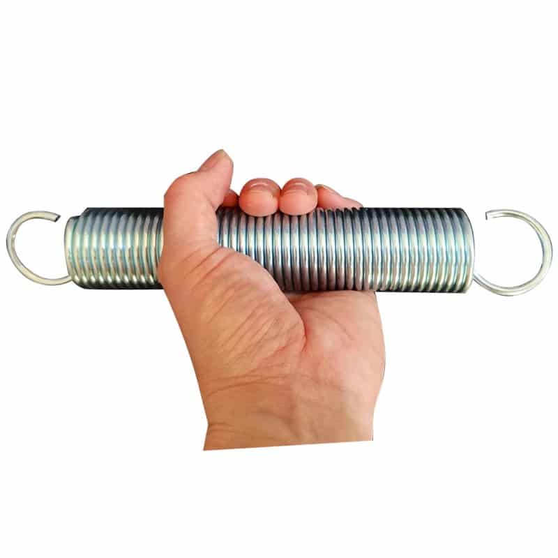 Hand holding a large heavy duty extension spring with hook ends (Zigoal)