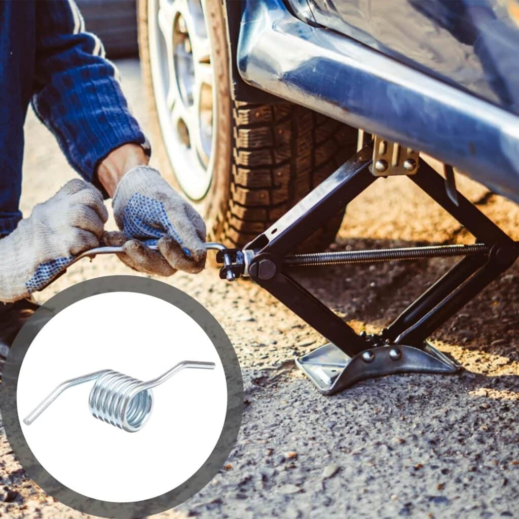 Torsion spring shown beside a scissor jack lifting a car (Zigoal)