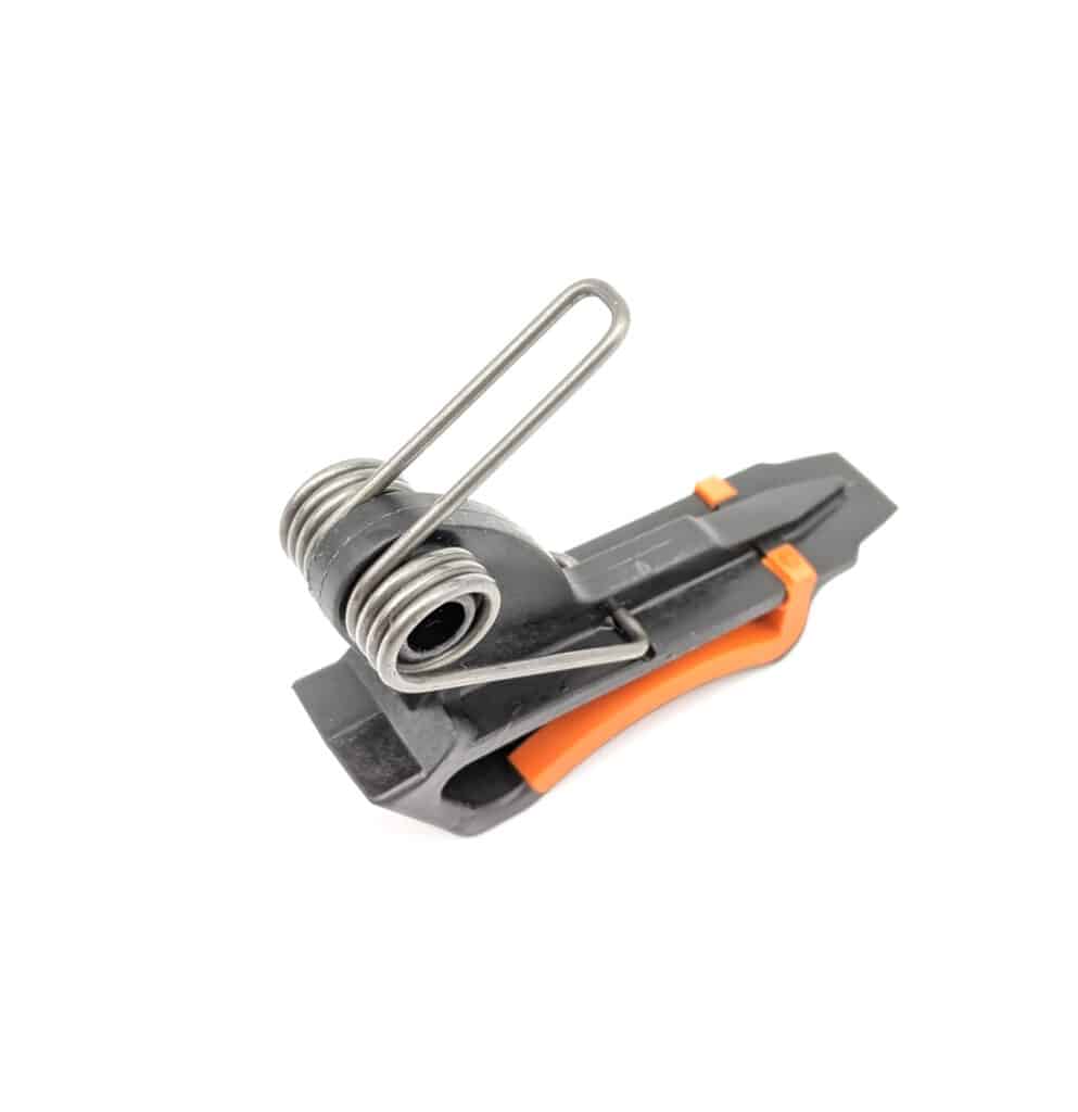 Torsion spring fitted in a molded trigger mechanism (Zigoal)