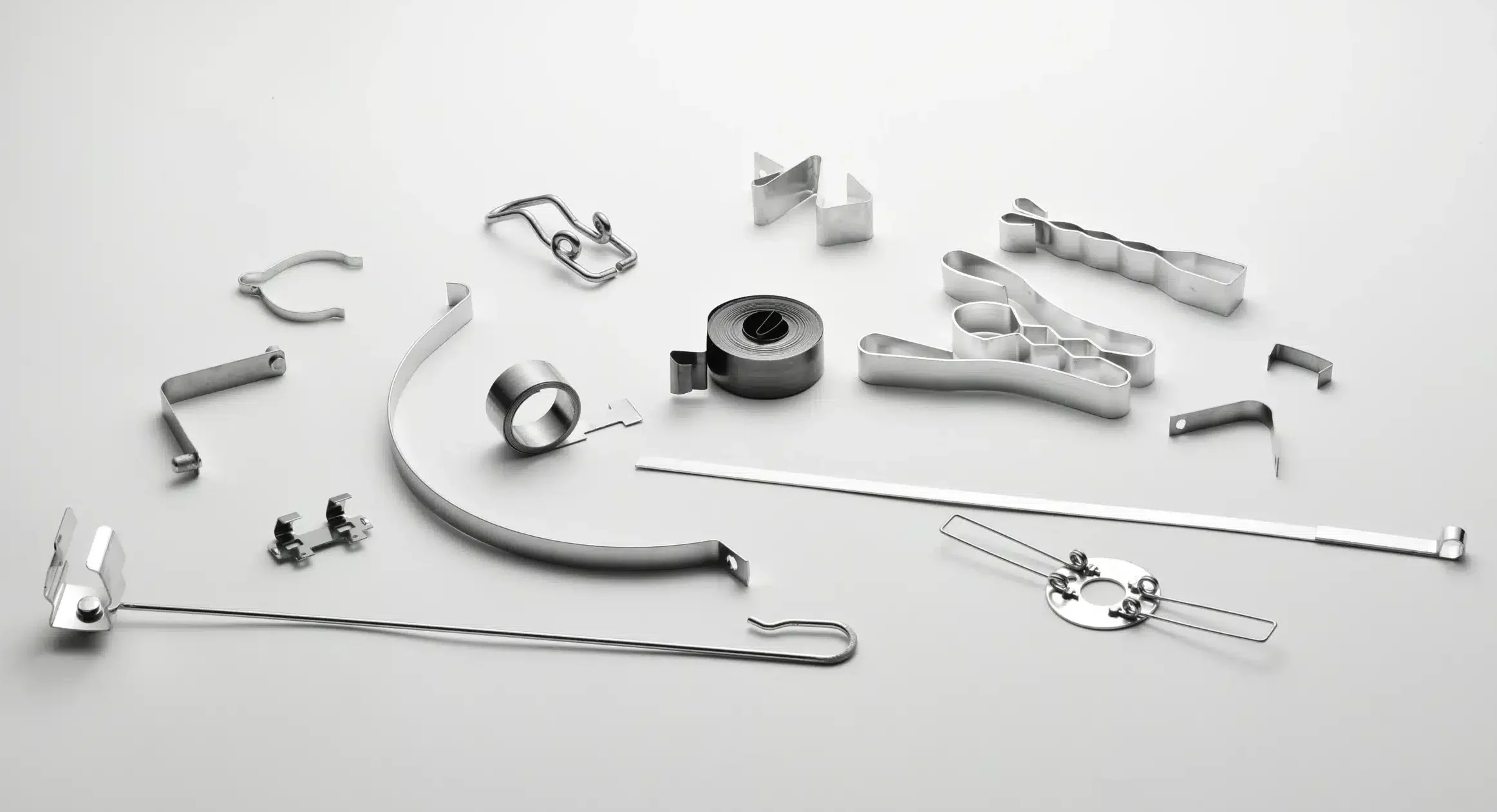 Range of custom flat springs, clips and stamped strip parts (Zigoal)