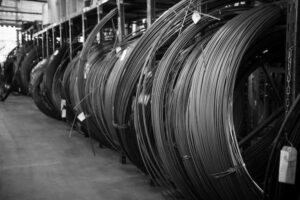 Compression Spring Material: A Comprehensive Guide 1 Coils of spring wire stock stored in the material warehouse (Zigoal)